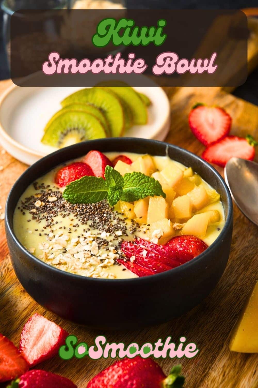 Kiwi smoothie bowl in black bowl and text overlay that says 'Kiwi Smoothie Bowl'.