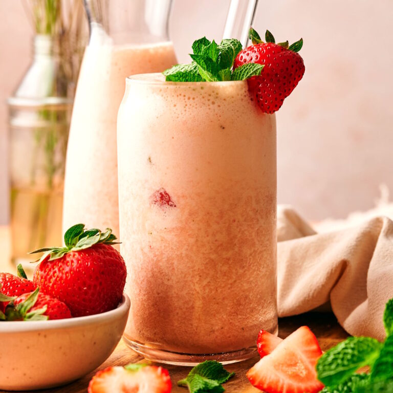 Strawberry banana smoothie in a tall glass.