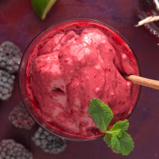 Blackberry smoothie with fresh mint leaves.