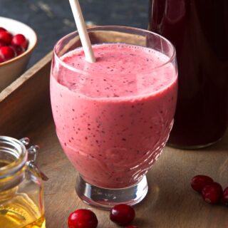 Cranberry smoothie in glass.