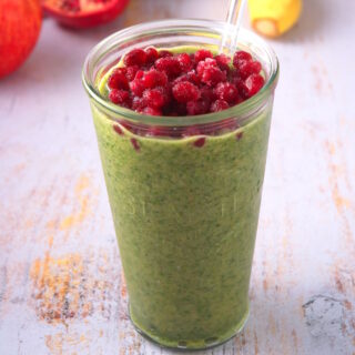 Kale smoothie with pomegranate seeds.