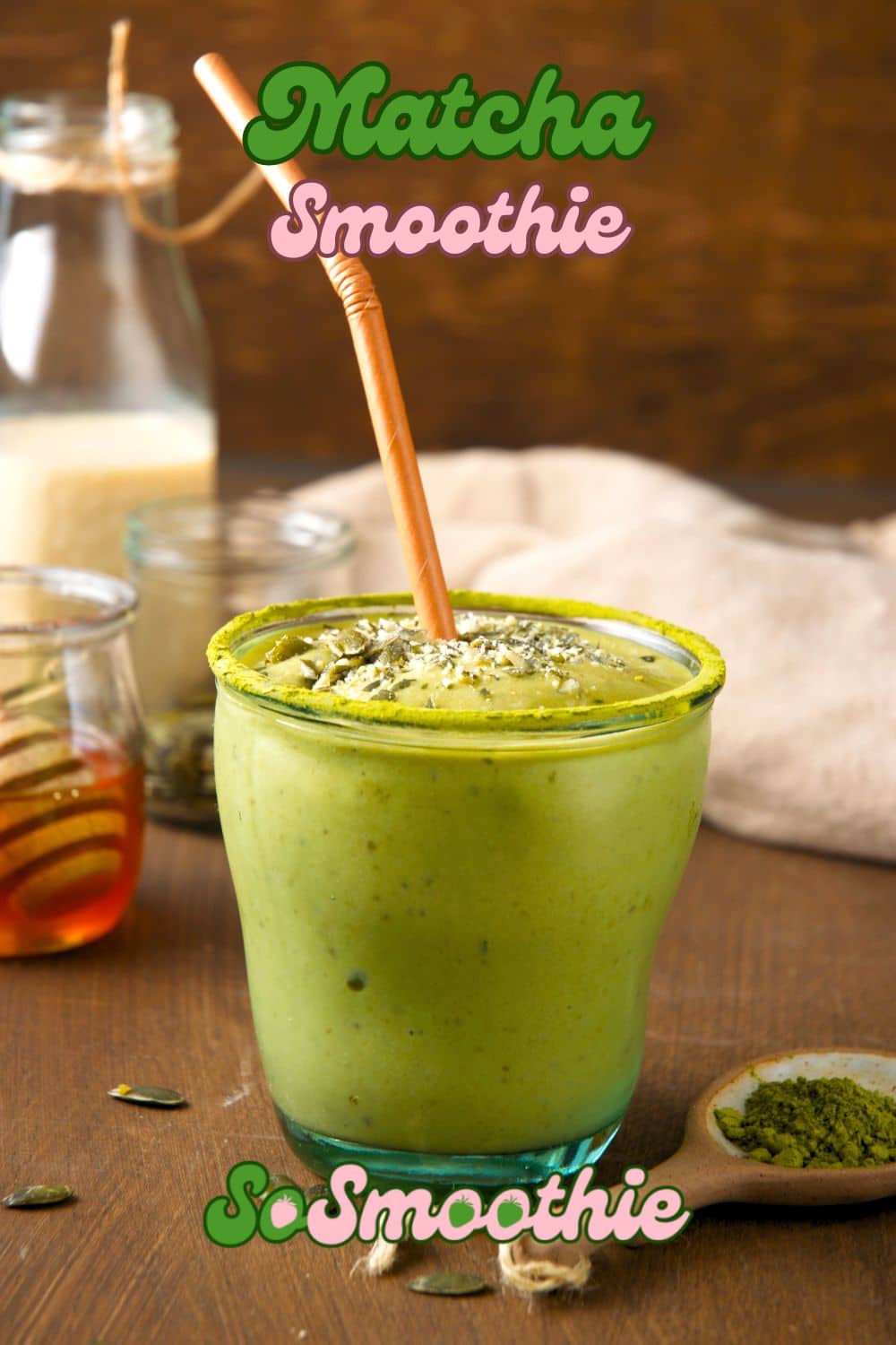 Matcha smoothie in a glass with brown paper straw.