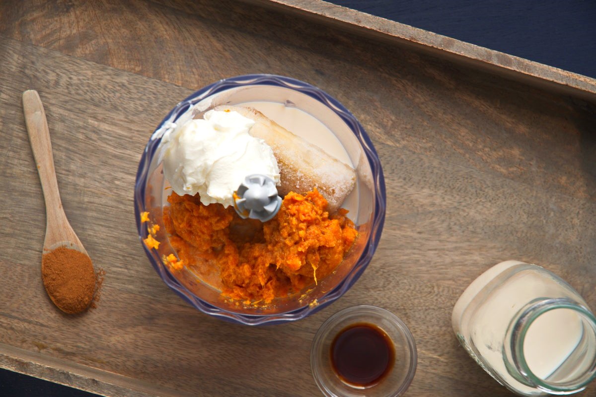 Sweet potato smoothie ingredients in food processor.